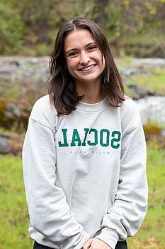 young woman in front of green background