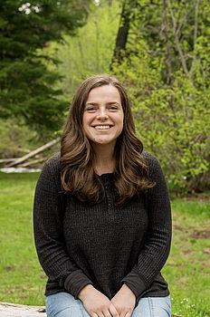 young woman in front of green background